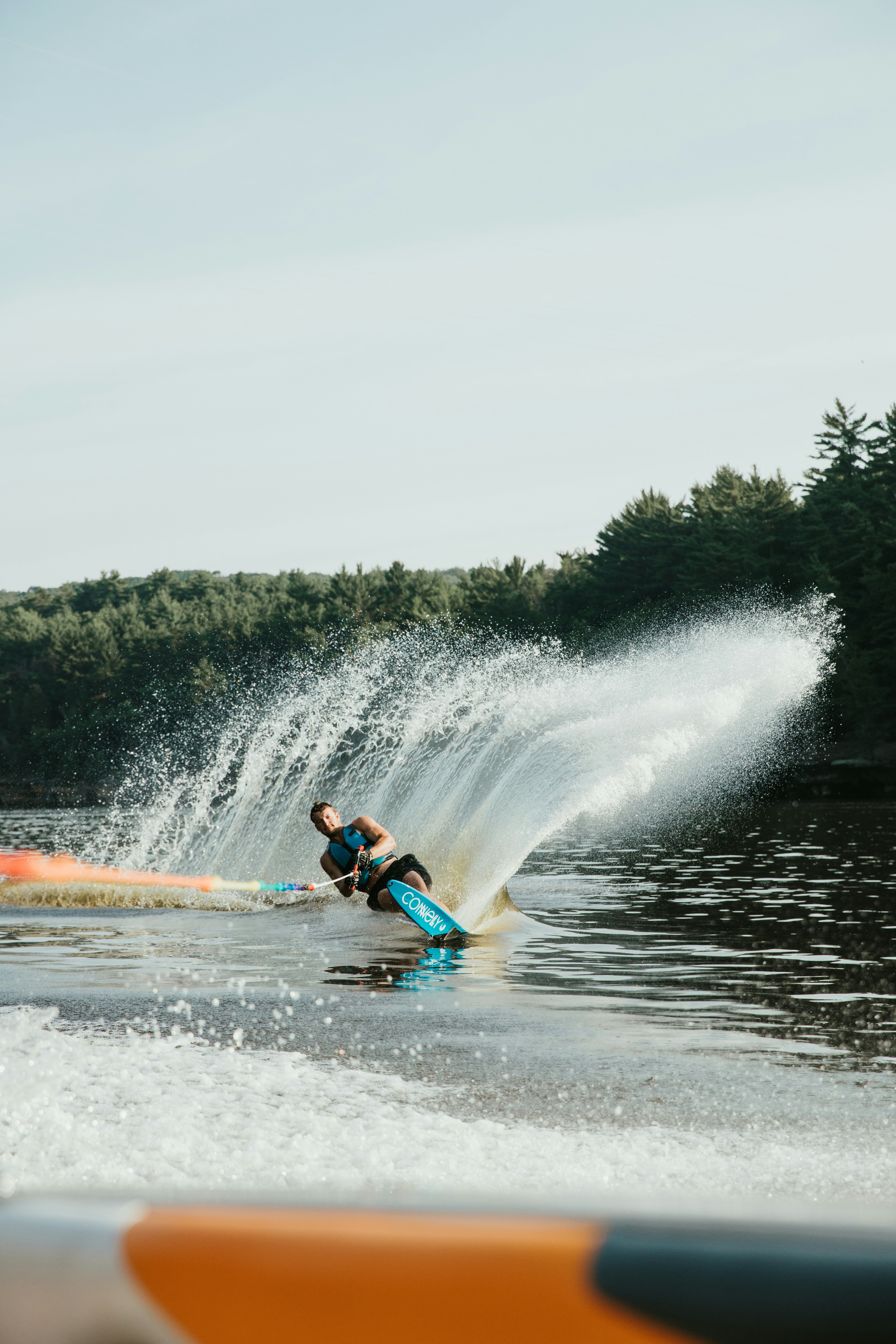 Waterskier cutting across the lake